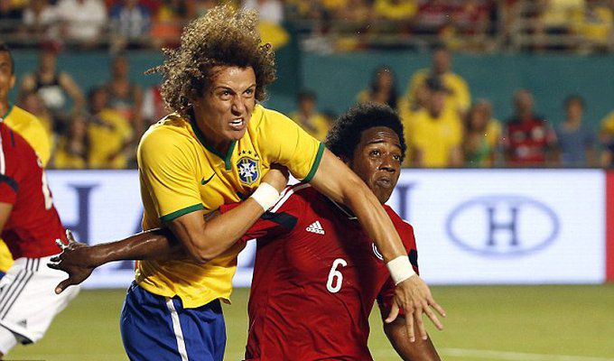 Brazil's former Chelsea defender David Luiz looks to get ah.jpg