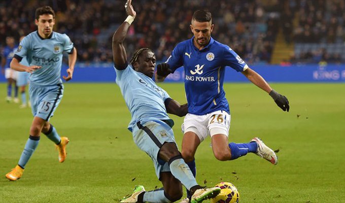Bacary Sagna of Manchester City FC in action with Riyad Mahrez (R) of Leicester City FC during their English Premier League match.jpg