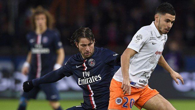 Maxwell of Paris Saint-Germain in action with Morgan Sanson (R) of Montpellier Herault SC during their French Ligue 1 match.jpg