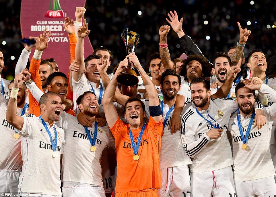 Real Madrid captain Iker Casillas (centre) lifts the FIFA Club World Cup trophy after they beat San Lorenzo.jpg