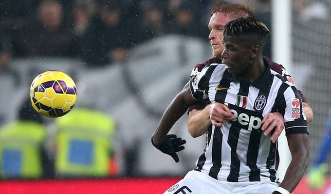 Alessandro Gazzi of Torino FC in action with Paul Pogba (Front) of Juventus during their Italian serie A match.jpg