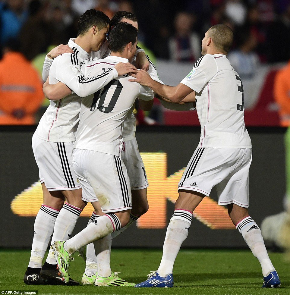 areth Bale is greeted by his team-mates Ronaldo (left), Rodriguez (centre) and Pepe after netting the.jpg