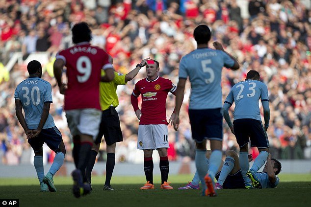 1411831996648_wps_1_Manchester_United_s_Wayne.jpg
